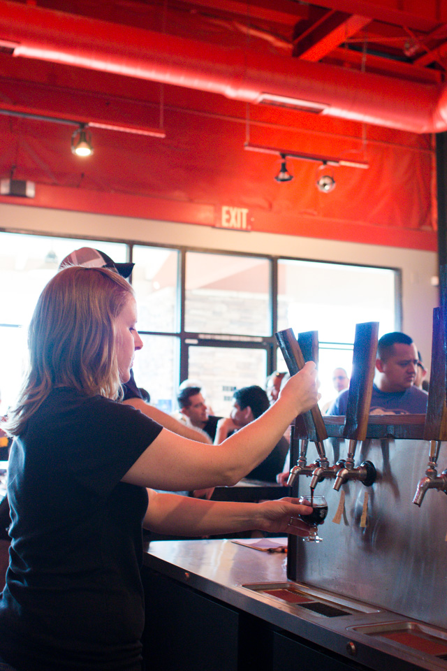 Heather pouring a one-off Imperial Belgian Chocolate Stout for a thirsty customer