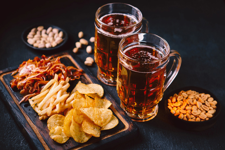 Two glasses of refreshing beer paired with foods