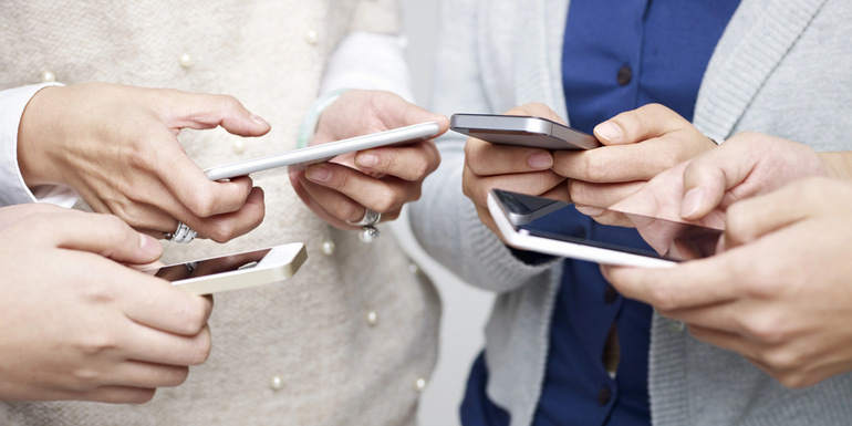 People playing Flip-A-Coin game on smartphones