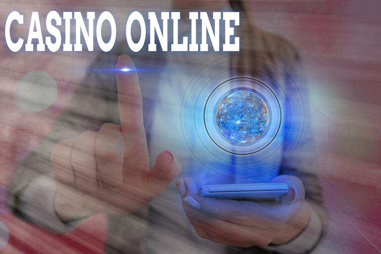 Person interacting with futuristic digital screen labeled "Casino Online," advanced technology behind the HitSpin casino game providers